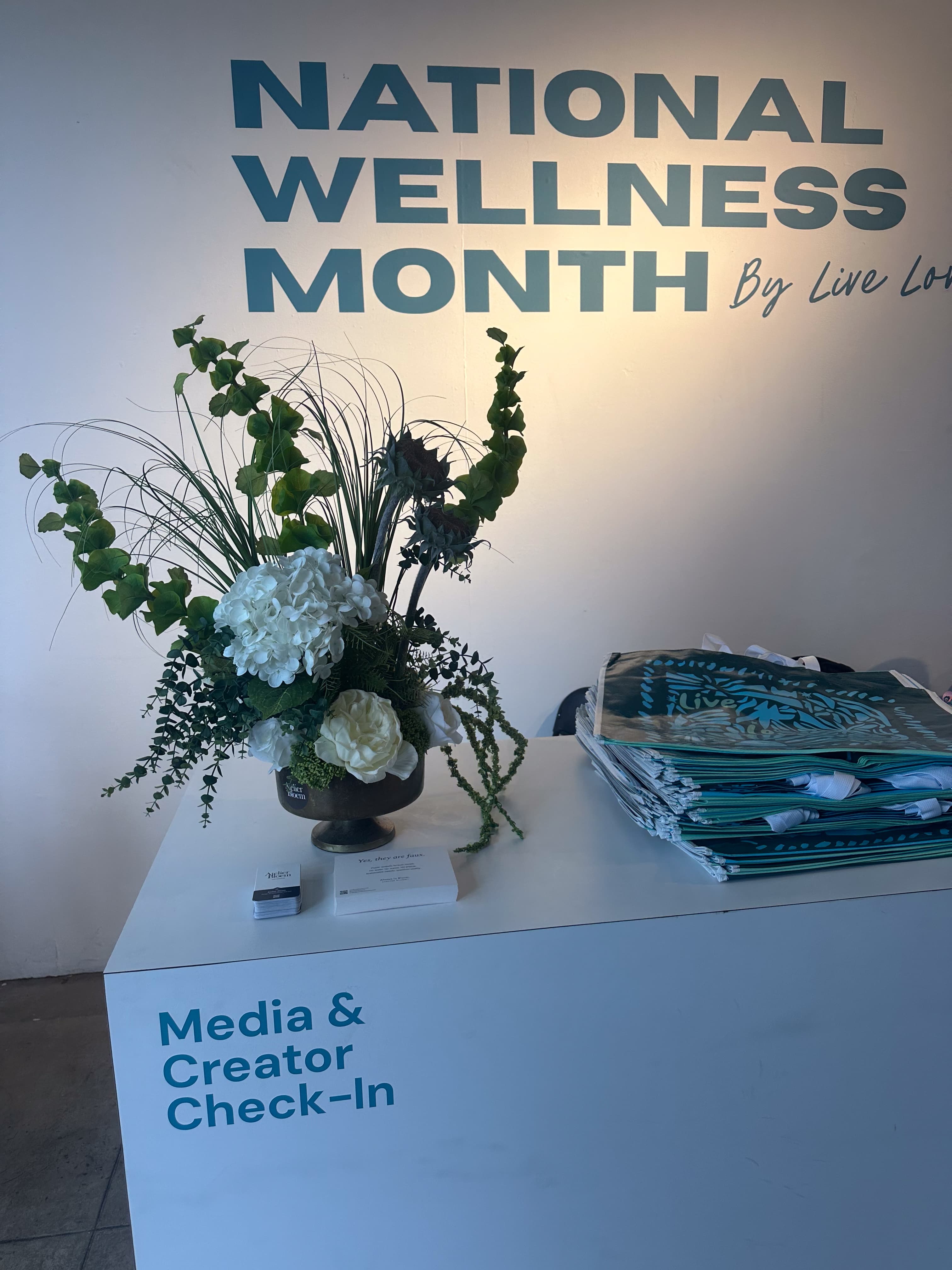 Atelier Bloem forever floral arrangement at the entrance of Hudson Loft during National Wellness Month