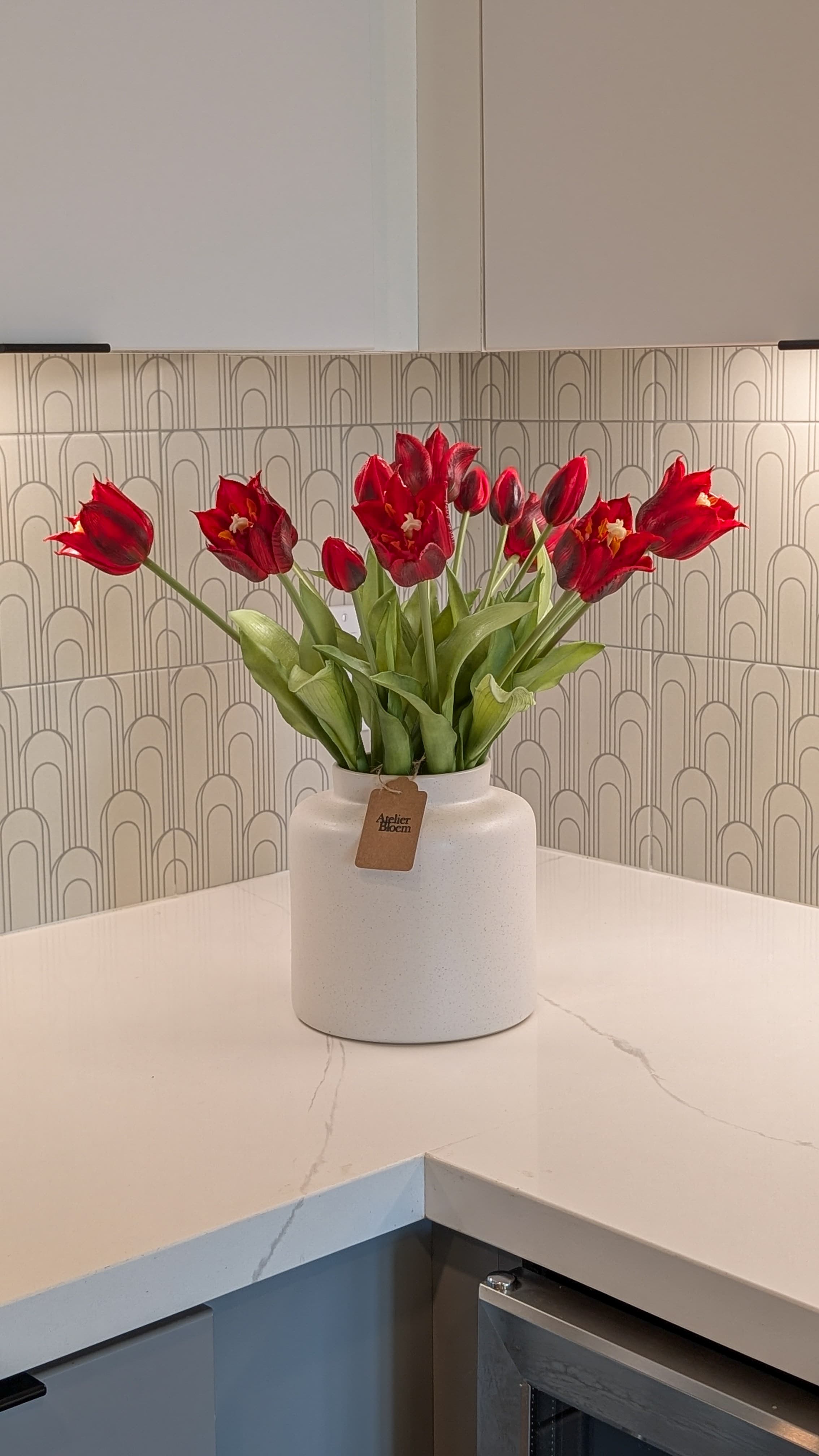 Red tulips by Atelier Bloem in a model apartment at The Charlie Mar Vista